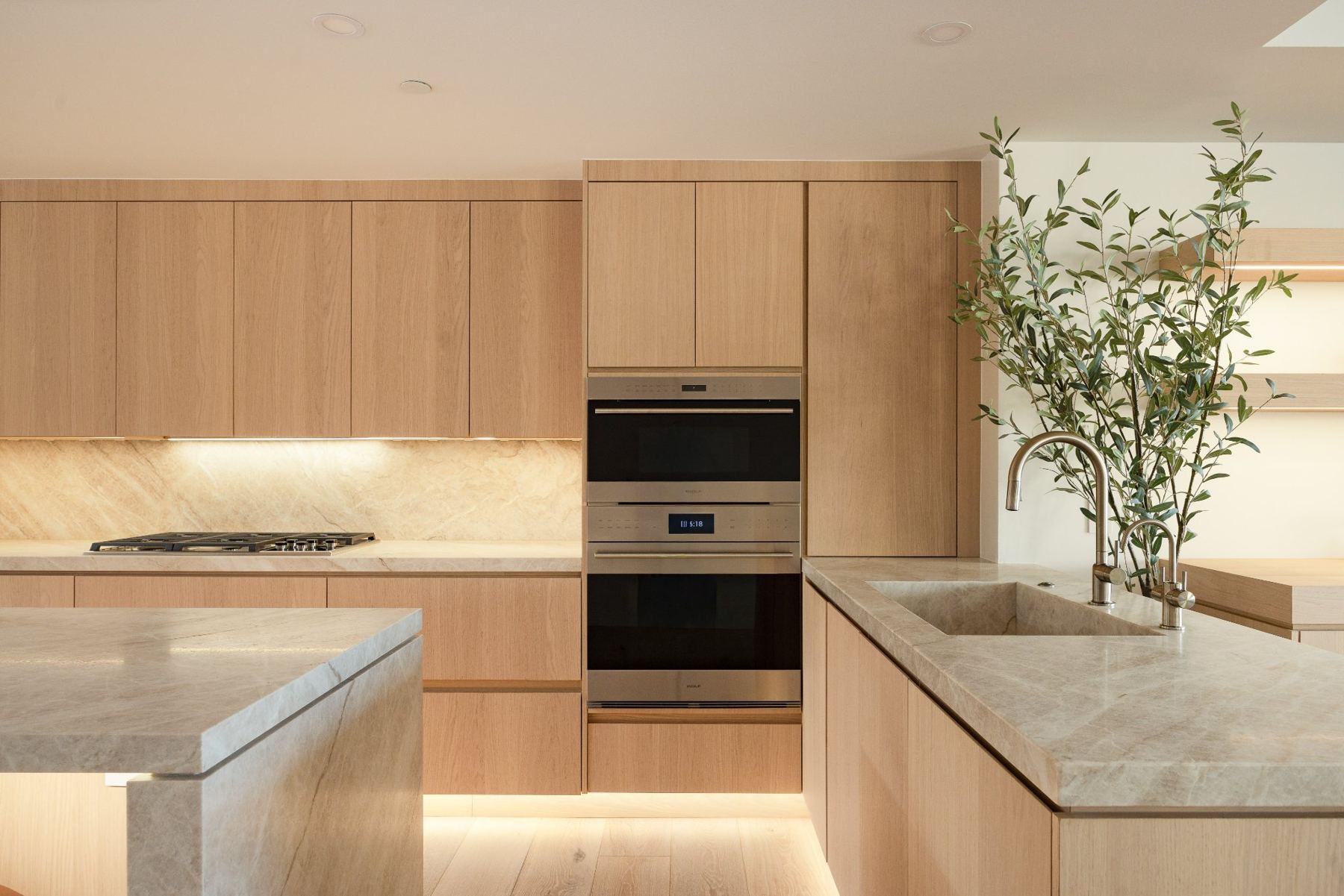 Kitchen with built-in ovens & stone island
